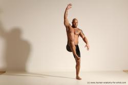 Underwear Gymnastic poses Man Black Muscular Bald Dancing Dynamic poses Academic